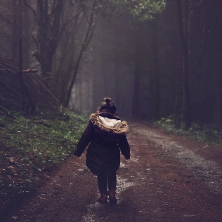 Girl Walking in Forest